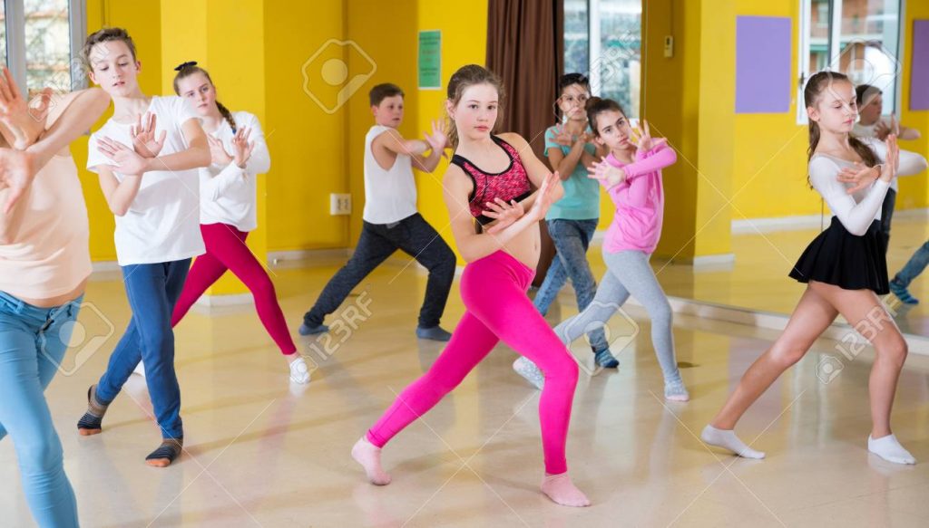 Children participating in dance class with teacher_7218